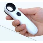 Lupa de mano blanca con luz LED para inspección de componentes electrónicos